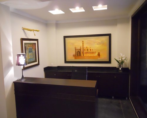 A clean, professionally managed reception area with soft, indirect lighting that prevents optical fatigue